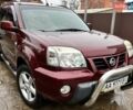 Красный Ниссан ИксТрейл, объемом двигателя 2 л и пробегом 227 тыс. км за 7250 $, фото 1 на Automoto.ua