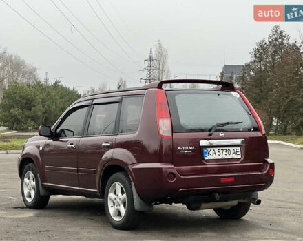 Красный Ниссан ИксТрейл, объемом двигателя 2.49 л и пробегом 298 тыс. км за 5999 $, фото 3 на Automoto.ua