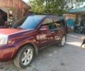 Красный Ниссан ИксТрейл, объемом двигателя 2.2 л и пробегом 250 тыс. км за 6000 $, фото 1 на Automoto.ua