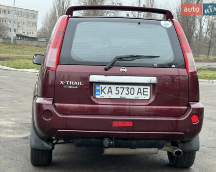 Красный Ниссан ИксТрейл, объемом двигателя 2.49 л и пробегом 298 тыс. км за 5999 $, фото 4 на Automoto.ua