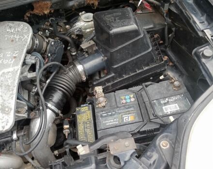 Красный Ниссан ИксТрейл, объемом двигателя 2.2 л и пробегом 335 тыс. км за 5008 $, фото 6 на Automoto.ua