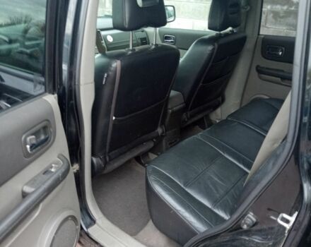 Красный Ниссан ИксТрейл, объемом двигателя 2.2 л и пробегом 335 тыс. км за 5008 $, фото 9 на Automoto.ua