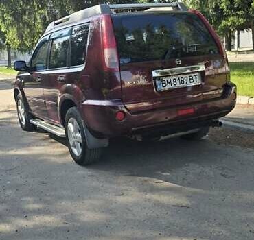 Красный Ниссан ИксТрейл, объемом двигателя 2 л и пробегом 172 тыс. км за 7299 $, фото 6 на Automoto.ua