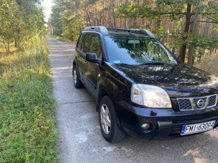 Красный Ниссан ИксТрейл, объемом двигателя 2.2 л и пробегом 335 тыс. км за 5008 $, фото 1 на Automoto.ua