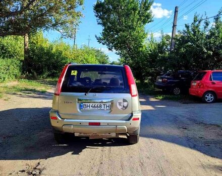 Сірий Ніссан ІксТрейл, об'ємом двигуна 2.5 л та пробігом 390 тис. км за 5000 $, фото 3 на Automoto.ua