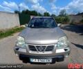 Серый Ниссан ИксТрейл, объемом двигателя 2 л и пробегом 275 тыс. км за 6300 $, фото 5 на Automoto.ua