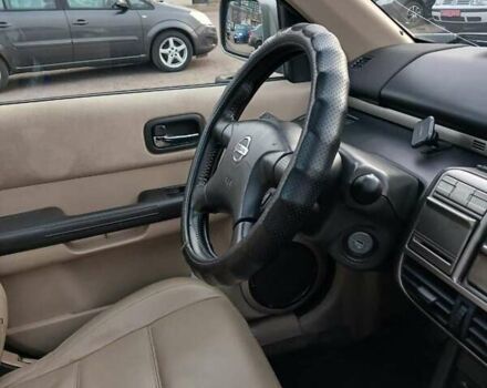 Серый Ниссан ИксТрейл, объемом двигателя 2.2 л и пробегом 256 тыс. км за 8000 $, фото 4 на Automoto.ua