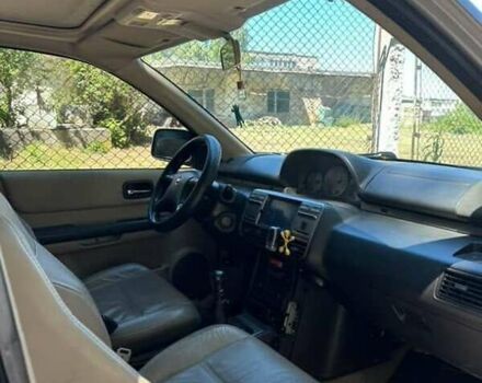 Серый Ниссан ИксТрейл, объемом двигателя 2.2 л и пробегом 281 тыс. км за 6500 $, фото 4 на Automoto.ua