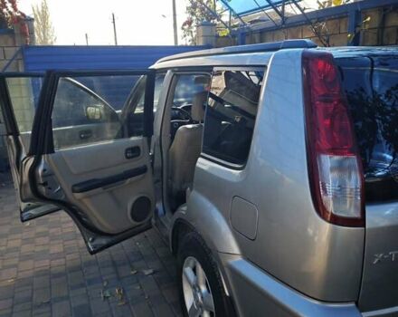 Сірий Ніссан ІксТрейл, об'ємом двигуна 2 л та пробігом 320 тис. км за 5500 $, фото 7 на Automoto.ua