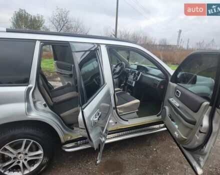 Серый Ниссан ИксТрейл, объемом двигателя 2.5 л и пробегом 450 тыс. км за 7000 $, фото 7 на Automoto.ua