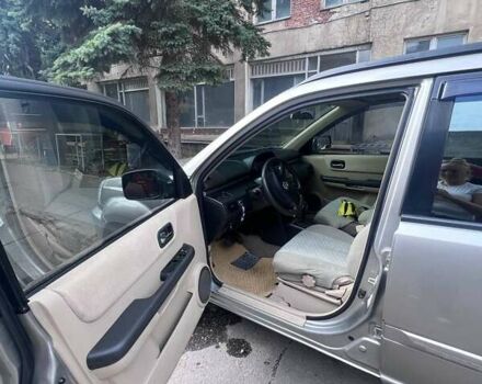 Серый Ниссан ИксТрейл, объемом двигателя 2 л и пробегом 262 тыс. км за 7079 $, фото 11 на Automoto.ua