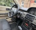 Серый Ниссан ИксТрейл, объемом двигателя 2 л и пробегом 335 тыс. км за 4900 $, фото 4 на Automoto.ua
