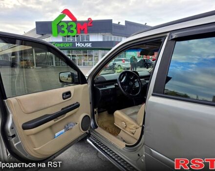 Серый Ниссан ИксТрейл, объемом двигателя 2 л и пробегом 220 тыс. км за 5800 $, фото 4 на Automoto.ua