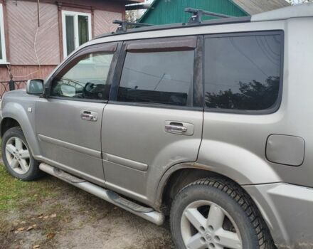 Серый Ниссан ИксТрейл, объемом двигателя 2 л и пробегом 297 тыс. км за 4500 $, фото 1 на Automoto.ua