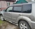 Серый Ниссан ИксТрейл, объемом двигателя 2 л и пробегом 297 тыс. км за 4500 $, фото 1 на Automoto.ua