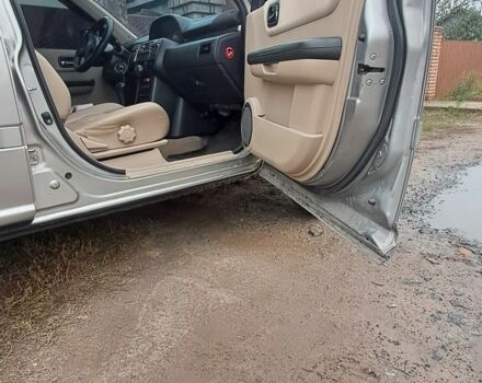 Серый Ниссан ИксТрейл, объемом двигателя 2 л и пробегом 290 тыс. км за 4950 $, фото 3 на Automoto.ua