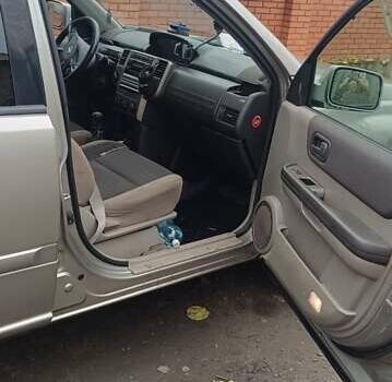 Серый Ниссан ИксТрейл, объемом двигателя 2.2 л и пробегом 230 тыс. км за 3300 $, фото 4 на Automoto.ua