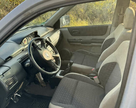 Серый Ниссан ИксТрейл, объемом двигателя 2.18 л и пробегом 320 тыс. км за 4900 $, фото 5 на Automoto.ua