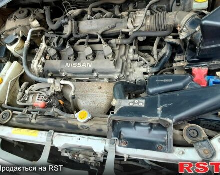 Серый Ниссан ИксТрейл, объемом двигателя 2 л и пробегом 210 тыс. км за 4500 $, фото 3 на Automoto.ua