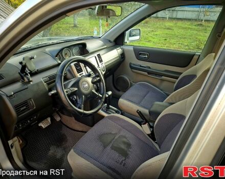 Серый Ниссан ИксТрейл, объемом двигателя 2 л и пробегом 208 тыс. км за 7300 $, фото 7 на Automoto.ua