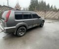 Серый Ниссан ИксТрейл, объемом двигателя 2 л и пробегом 303 тыс. км за 3600 $, фото 1 на Automoto.ua