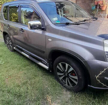 Сірий Ніссан ІксТрейл, об'ємом двигуна 2 л та пробігом 310 тис. км за 9500 $, фото 1 на Automoto.ua