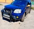 Синий Ниссан ИксТрейл, объемом двигателя 2 л и пробегом 250 тыс. км за 6000 $, фото 1 на Automoto.ua