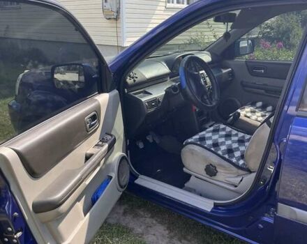 Синий Ниссан ИксТрейл, объемом двигателя 2 л и пробегом 246 тыс. км за 5400 $, фото 3 на Automoto.ua