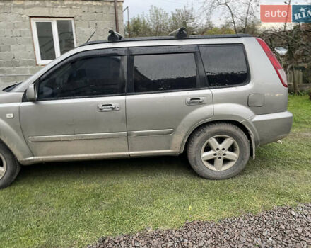 Синий Ниссан ИксТрейл, объемом двигателя 2.4 л и пробегом 299 тыс. км за 4600 $, фото 2 на Automoto.ua