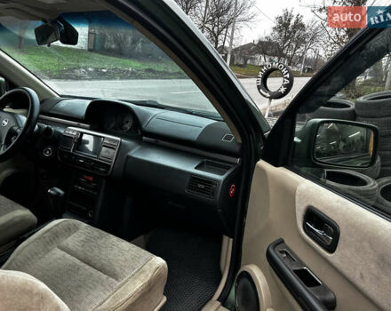 Зеленый Ниссан ИксТрейл, объемом двигателя 2 л и пробегом 308 тыс. км за 5700 $, фото 13 на Automoto.ua