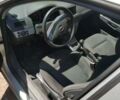 Серый Опель Астра Н, объемом двигателя 1.6 л и пробегом 210 тыс. км за 5500 $, фото 2 на Automoto.ua