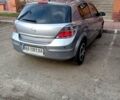 Серый Опель Астра Н, объемом двигателя 1.6 л и пробегом 160 тыс. км за 5500 $, фото 2 на Automoto.ua