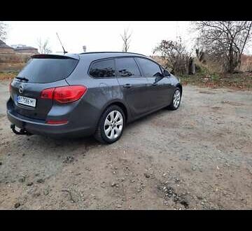 Сірий Опель Астра Джей, об'ємом двигуна 1.6 л та пробігом 248 тис. км за 6550 $, фото 1 на Automoto.ua