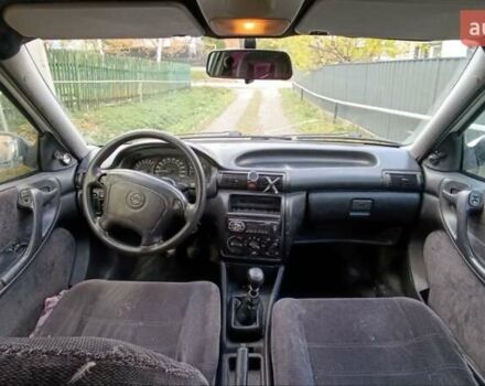 Білий Опель Астра, об'ємом двигуна 1.6 л та пробігом 296 тис. км за 1300 $, фото 11 на Automoto.ua