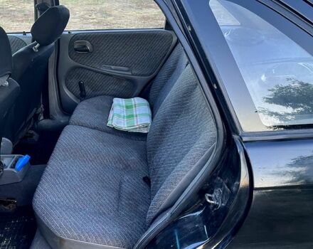 Черный Опель Астра, объемом двигателя 1.4 л и пробегом 379 тыс. км за 1200 $, фото 9 на Automoto.ua