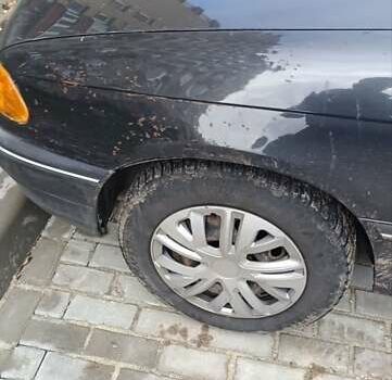 Черный Опель Астра, объемом двигателя 1.4 л и пробегом 256 тыс. км за 1450 $, фото 5 на Automoto.ua