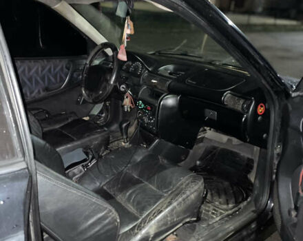 Черный Опель Астра, объемом двигателя 1.6 л и пробегом 300 тыс. км за 1200 $, фото 4 на Automoto.ua
