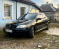 Черный Опель Астра, объемом двигателя 1.6 л и пробегом 264 тыс. км за 1300 $, фото 1 на Automoto.ua