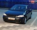Черный Опель Астра, объемом двигателя 1.6 л и пробегом 246 тыс. км за 3700 $, фото 1 на Automoto.ua