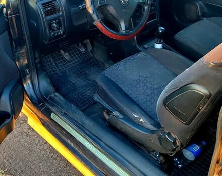 Черный Опель Астра, объемом двигателя 1.6 л и пробегом 330 тыс. км за 2000 $, фото 1 на Automoto.ua