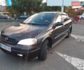 Черный Опель Астра, объемом двигателя 1.6 л и пробегом 220 тыс. км за 4000 $, фото 1 на Automoto.ua