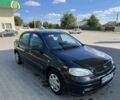 Черный Опель Астра, объемом двигателя 1.6 л и пробегом 220 тыс. км за 3648 $, фото 1 на Automoto.ua