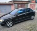 Черный Опель Астра, объемом двигателя 1.6 л и пробегом 240 тыс. км за 3589 $, фото 1 на Automoto.ua