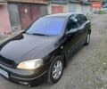 Черный Опель Астра, объемом двигателя 1.6 л и пробегом 240 тыс. км за 3589 $, фото 23 на Automoto.ua