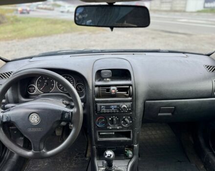 Черный Опель Астра, объемом двигателя 1.6 л и пробегом 258 тыс. км за 1350 $, фото 9 на Automoto.ua