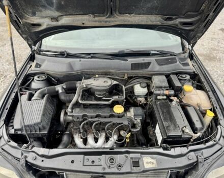 Черный Опель Астра, объемом двигателя 1.6 л и пробегом 258 тыс. км за 1350 $, фото 10 на Automoto.ua