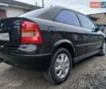 Черный Опель Астра, объемом двигателя 1.6 л и пробегом 240 тыс. км за 3589 $, фото 96 на Automoto.ua