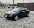 Черный Опель Астра, объемом двигателя 1.6 л и пробегом 258 тыс. км за 1350 $, фото 1 на Automoto.ua