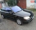 Черный Опель Астра, объемом двигателя 1.6 л и пробегом 240 тыс. км за 3589 $, фото 15 на Automoto.ua
