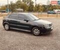 Черный Опель Астра, объемом двигателя 1.4 л и пробегом 180 тыс. км за 2600 $, фото 1 на Automoto.ua